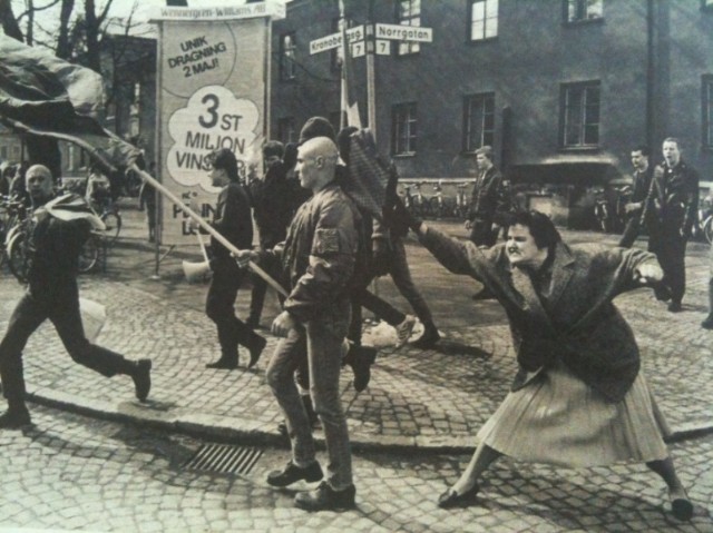 A Swedish woman hitting a neo-Nazi protester with her handbag. The woman was reportedly a concentration camp survivor. [1985]