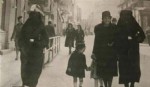 A Muslim woman covers the yellow star of her Jewish neighbour with her veil to protect her from prosecution. Sarajevo, former Yugoslavia. [1941]